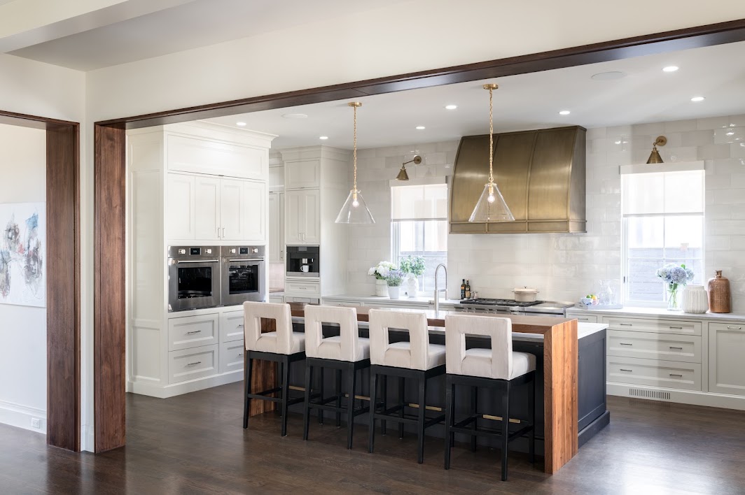Full kitchen remodel with warm wood cabinetry and stone counters